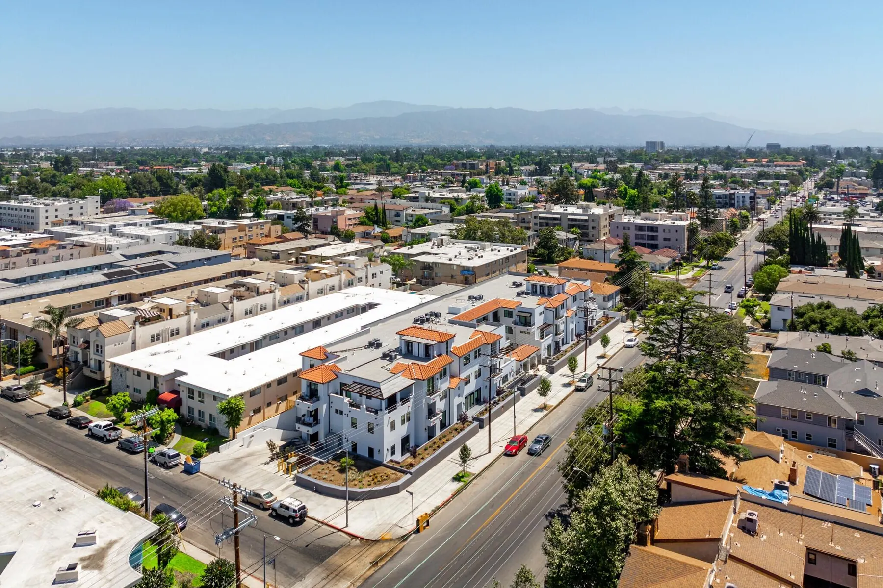 Aerial view of M Street Residences, a multi-unit building Valley Vista Builders built in Valley Village, with the mountains beyond